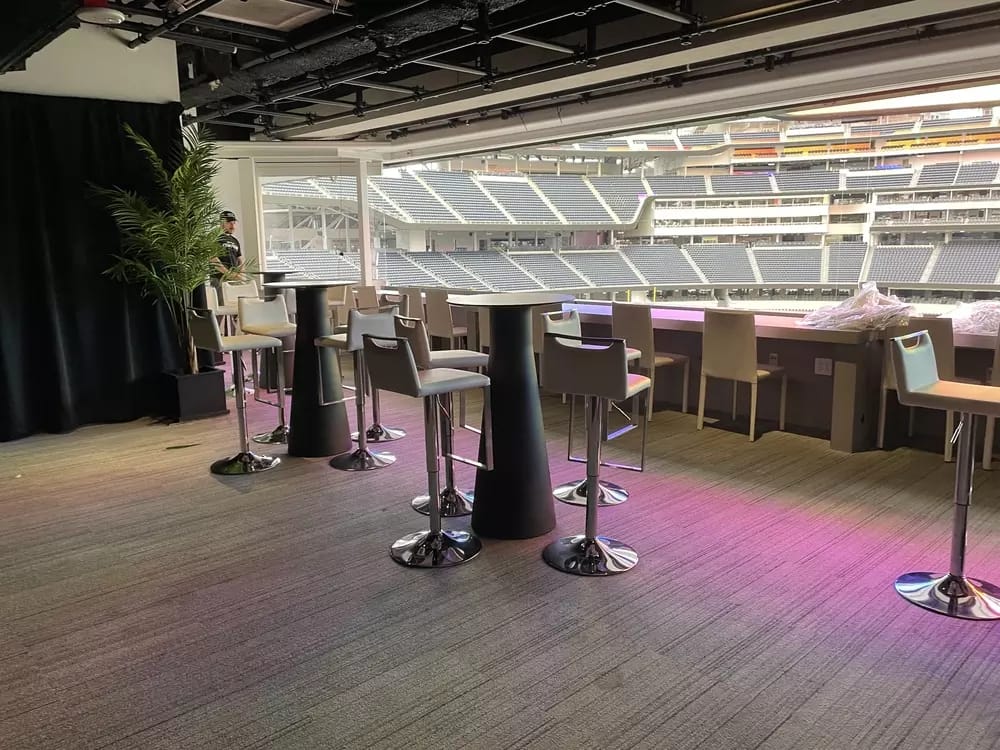 Interior of the upper part of the suite. All seating in the suite is barstool style seating at either high-top tables or counter tops.
