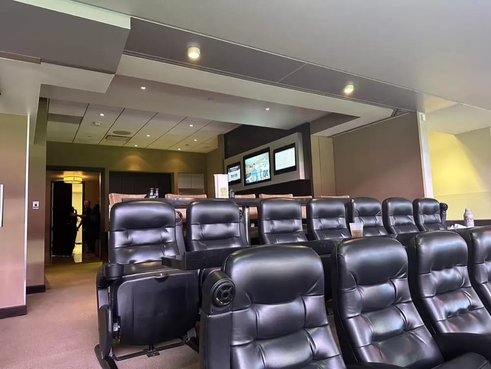 Optum Club suites feature two rows of padded stadium seats and a row of barstool seats behind.
