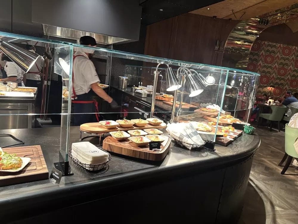 Upscale food stations and open bar in the Courtside Lounge