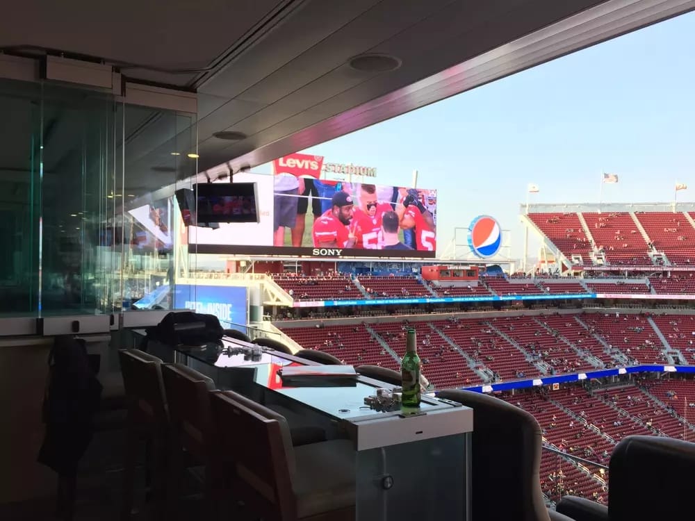 Barstool seating overlooking Levi's Stadium field.