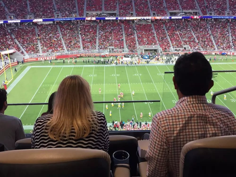 Comfortable padded seats are in front of barstool seats with a great view of the action. 